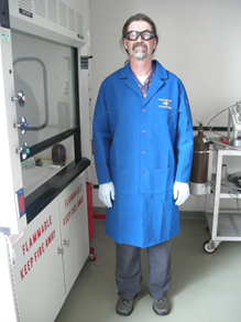 Researcher wearing a flame resistant lab coat