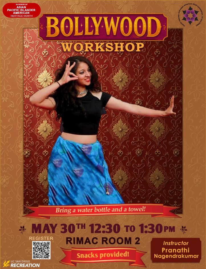 Person with a black top and blue skirt dancing