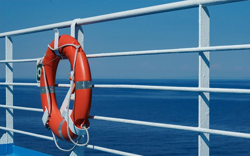 life-ring fastened to boat railings.