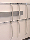 Wall-anchoring system using Unistrut® with flexible tethers. 