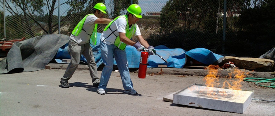 2 of 3, UC San Diego staff practices using fire extinguisher - CERT Class / Training for Emergency Preparedness