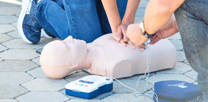 hands-only CPR on practice mannequins