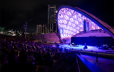 Epstein Family Amphitheater at night with stage lights lit up
