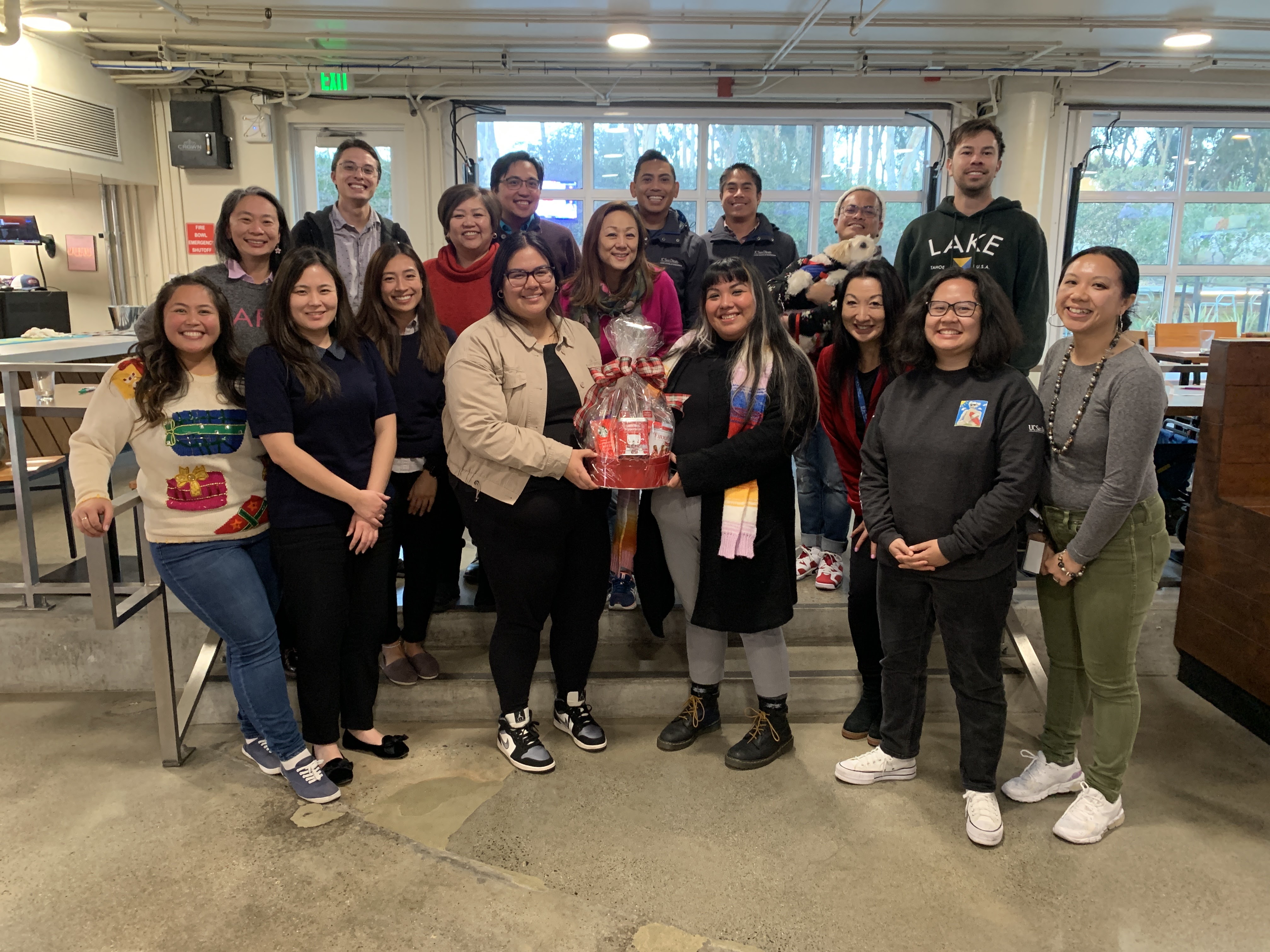 group of people standing with a raffle